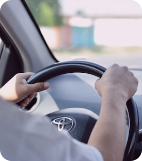 Driver hands on wheel